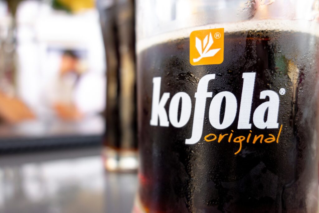 The glass of Czech Kofola beverage which resembles various cola drinks - Trade Info Kofola zisky akcie Kofola československo burza