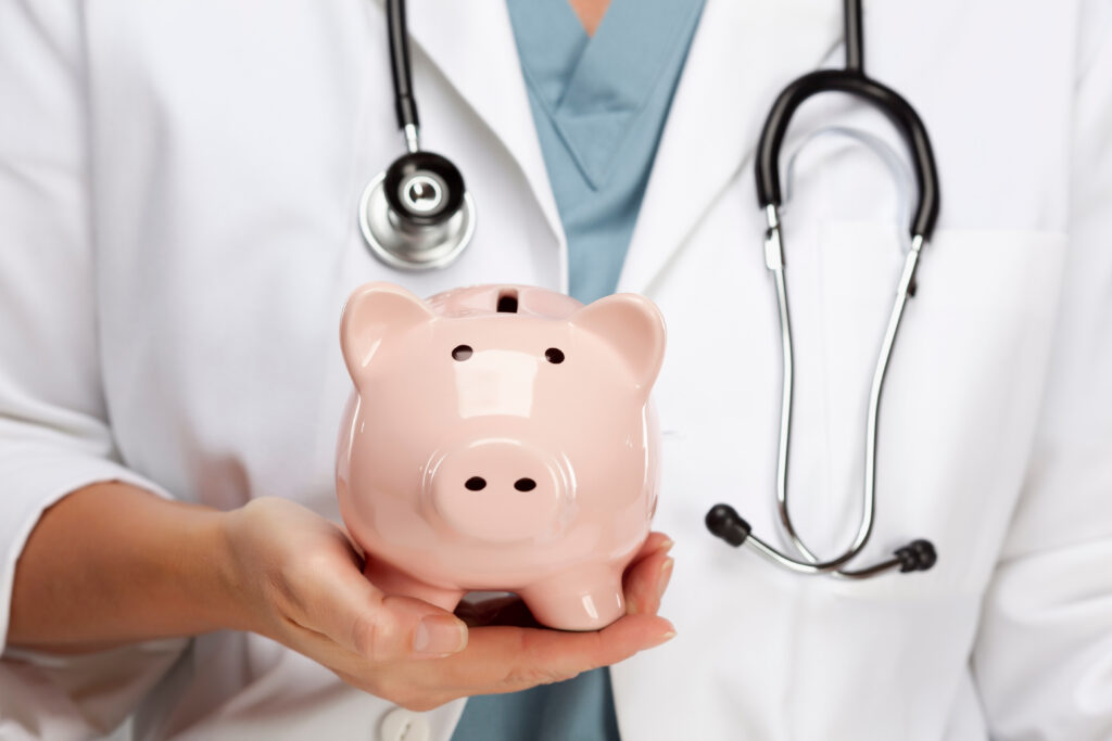 Female Doctor with Stethoscope Holding Piggy Bank Abstract - Trade Info kríza, zdravotníctva