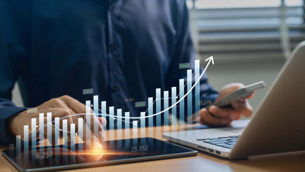 Stock market analytics and business growth professional reviewing financial reports investment performance and rising stock charts representing business strategy and wealth management - Trade Info trading