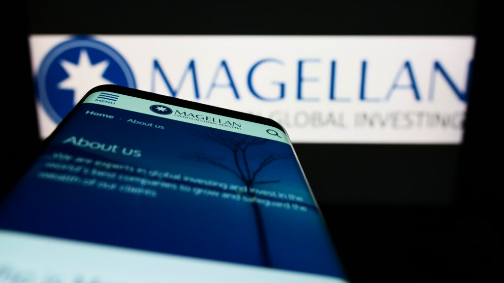 Stuttgart Germany - 05-21-2022 Smartphone with website of company Magellan Financial Group Limited on screen in front of business logo Focus on top-left of phone display - Trade Info Peter Lynch, Magellan Fund