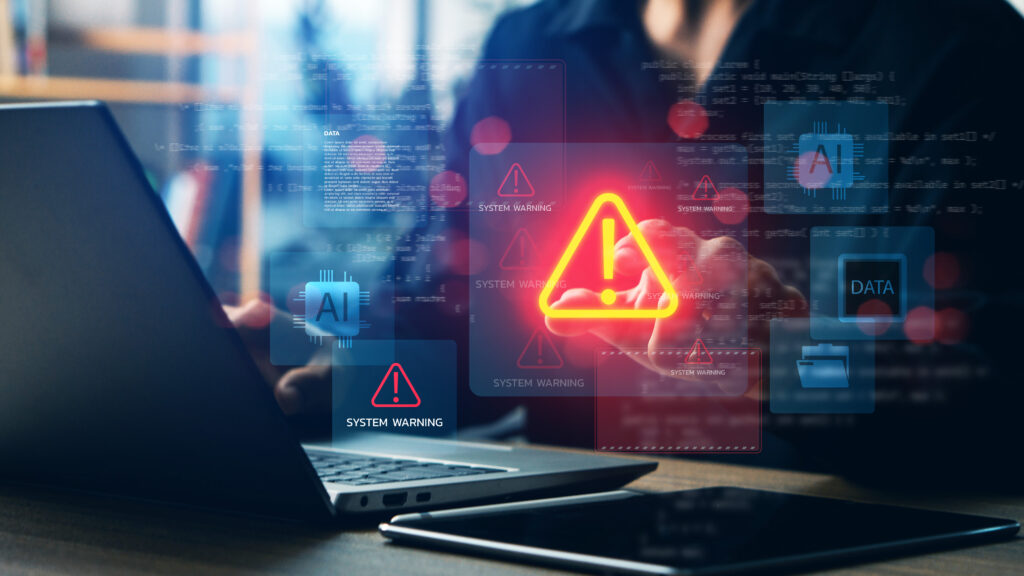 Cybersecurity system warning alert on laptop with AI and data icons concept of artificial intelligence risks data breach malware attack digital security and technology protection - Trade Info