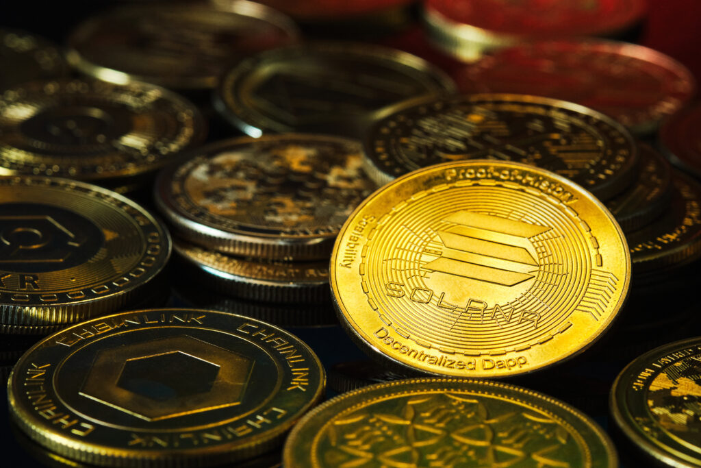 Golden cryptocurrency coins stacked together with focus on Solana - Trade Info Solana