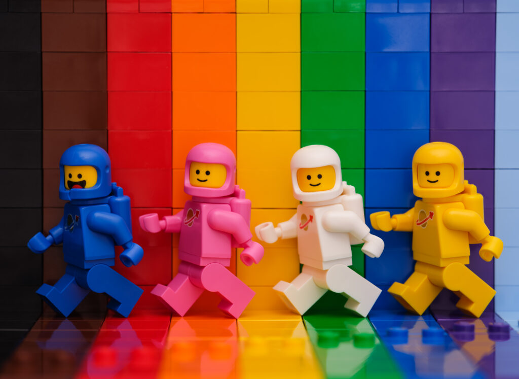 Tambov Russian Federation - November 07 2022 Four Lego astronaut minifigures walking in front of a rainbow backdrop - Trade Info Lego