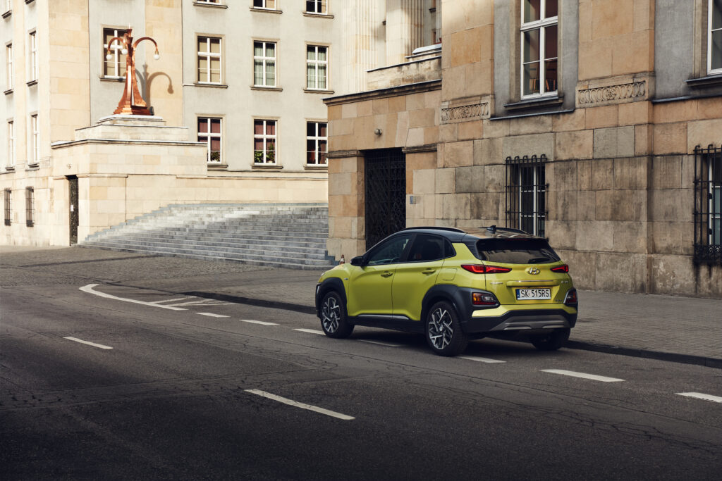 KatowicePoland -02162020 Hybrid Hyundai Kona parked next to the modernist Voivodship Office building The total power of the gasoline and electric engine is 141hp - Trade Info Automobilka Hyundai