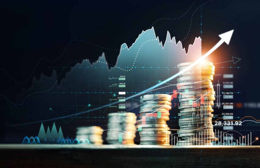 Stacks of coins with a rising arrow and stock charts, symbolizing financial growth, investment gains, or wealth increase.